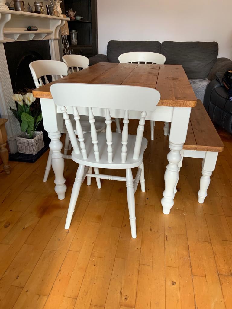 Dining table with painted white legs and stained wood top